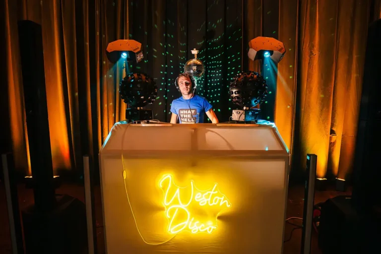 DJ HAMEZ banging out the tunes smiling yellow