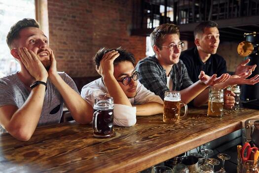 lads at bar doing quiz